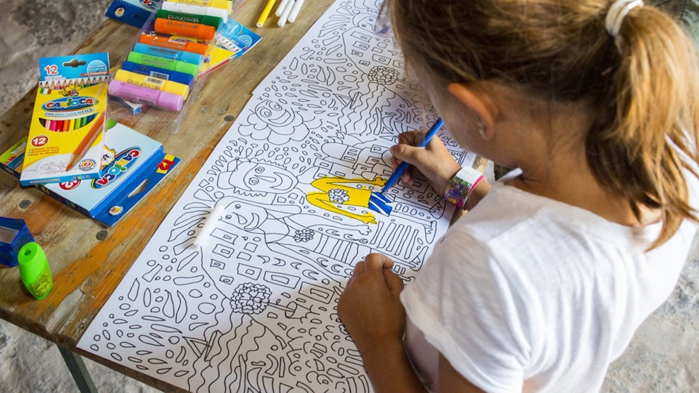 Kid Drawing With Yellow And Blue