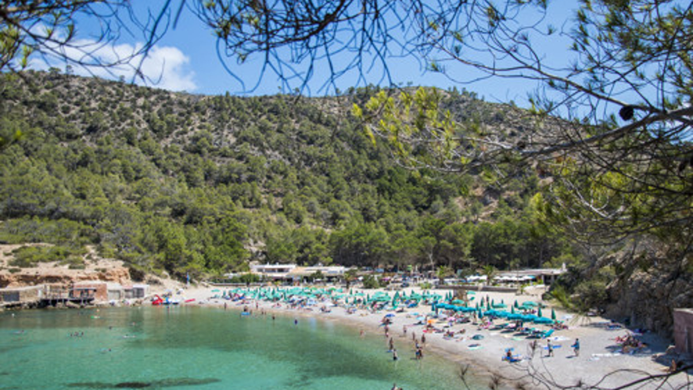 People On The Beach In Benirass