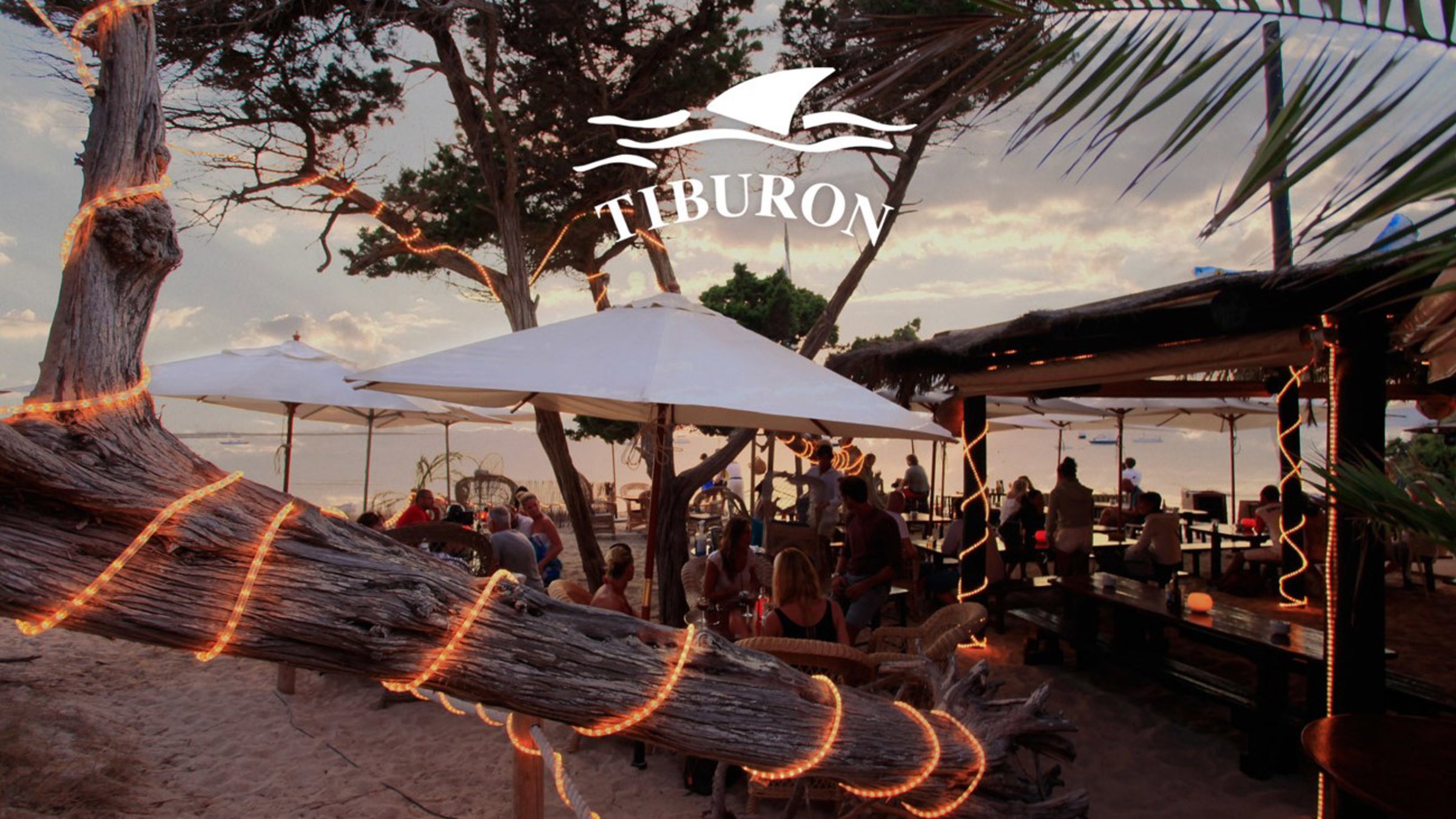 Restaurant By The Beach With People Seating