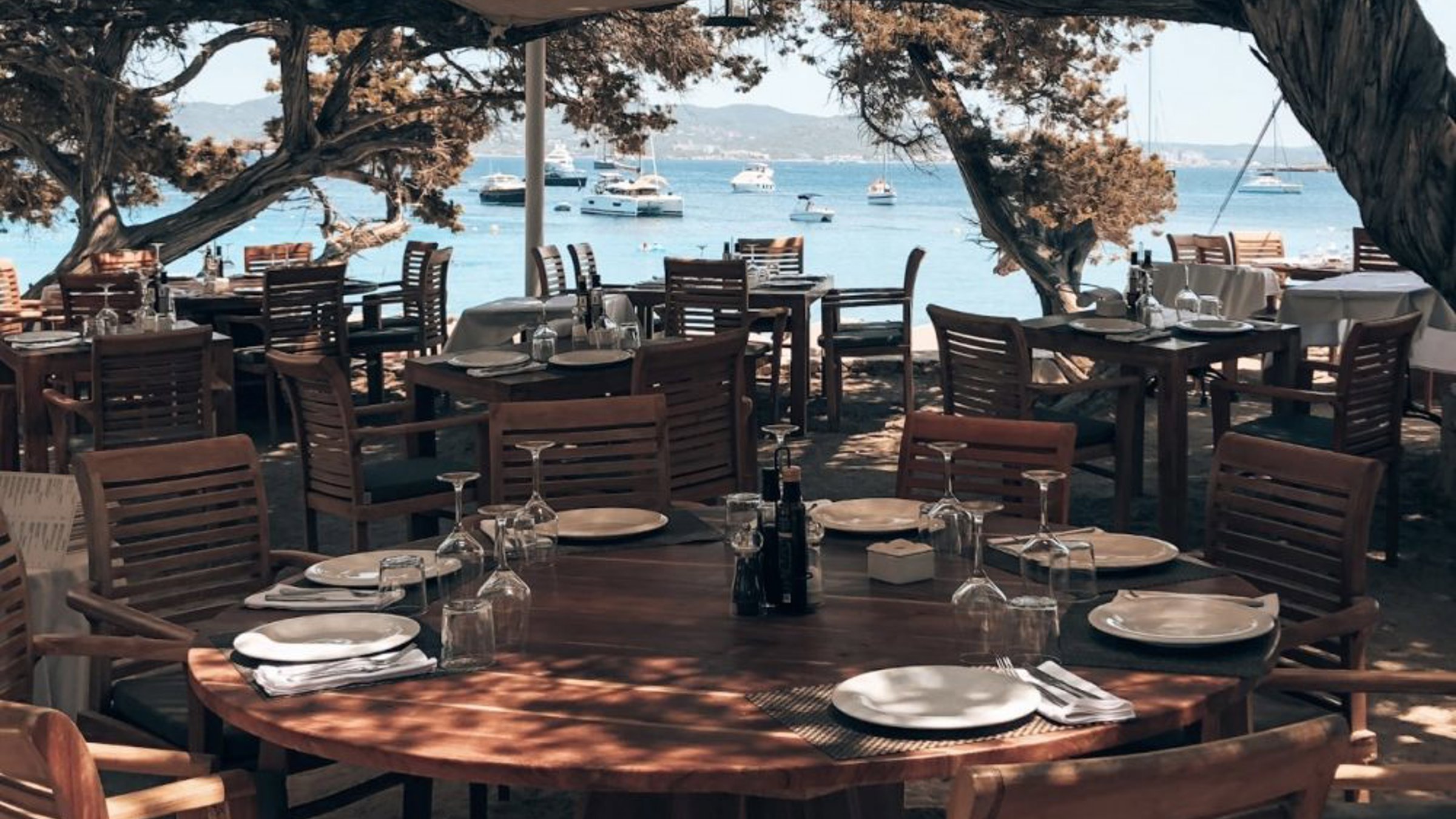 Restaurant Setup By The Beach In The Shadow