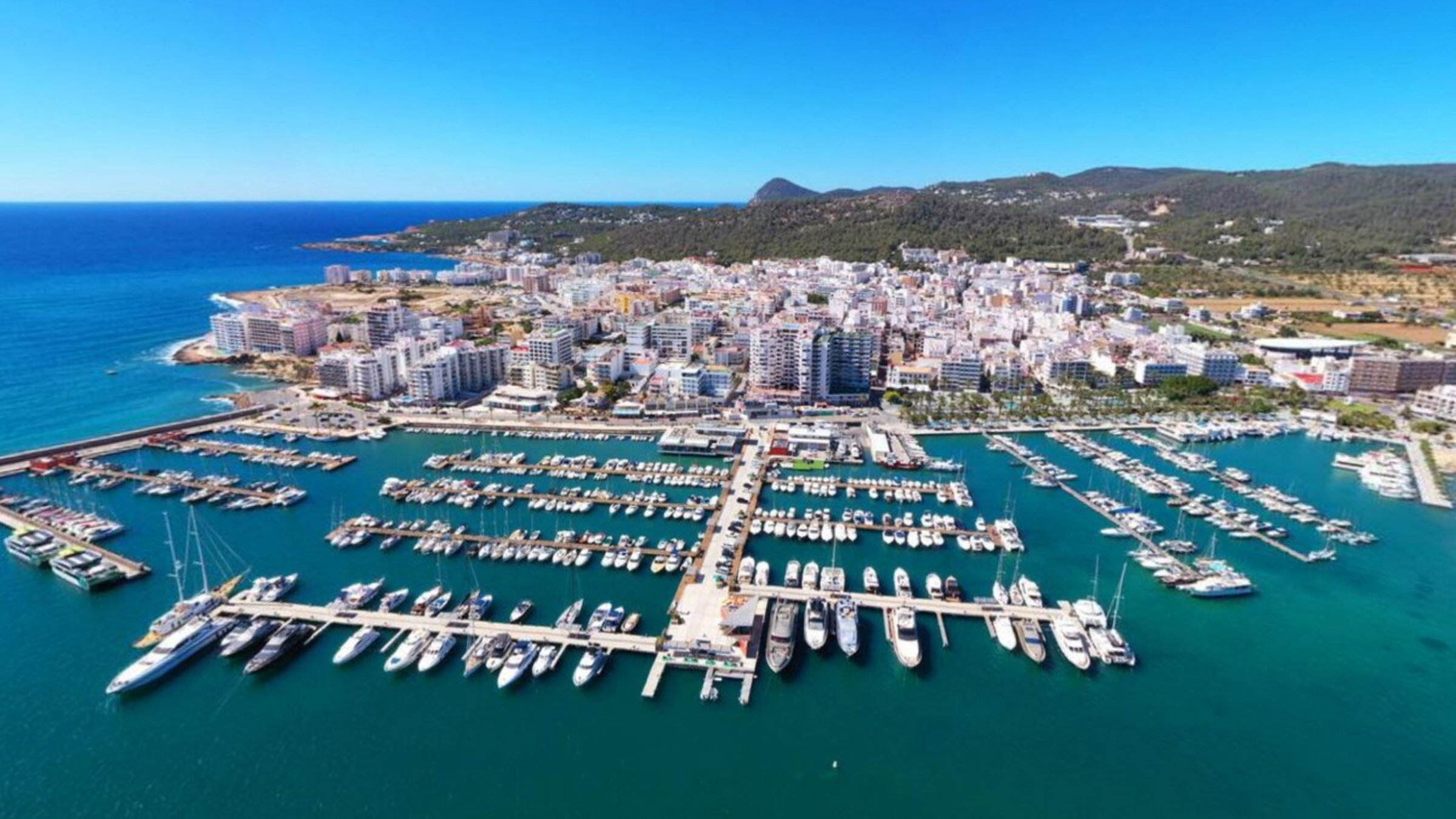 Boats Port With Blue Sea And City From Aerial