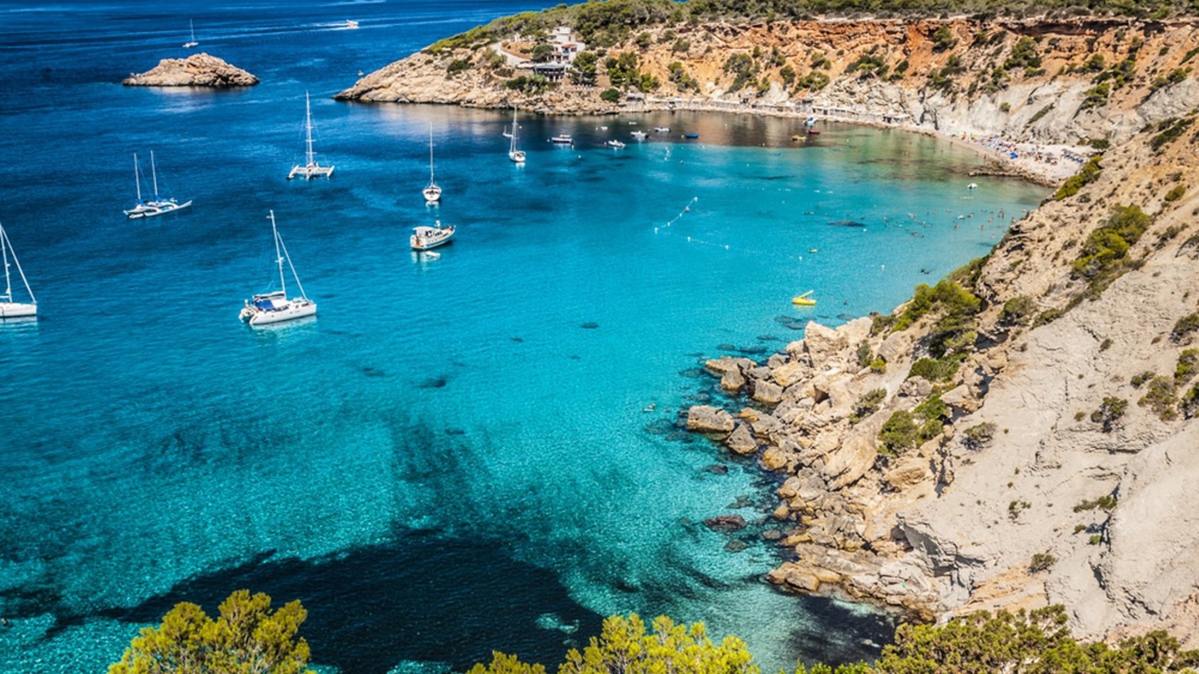 Ibiza Coast With Boats And Clear Sea