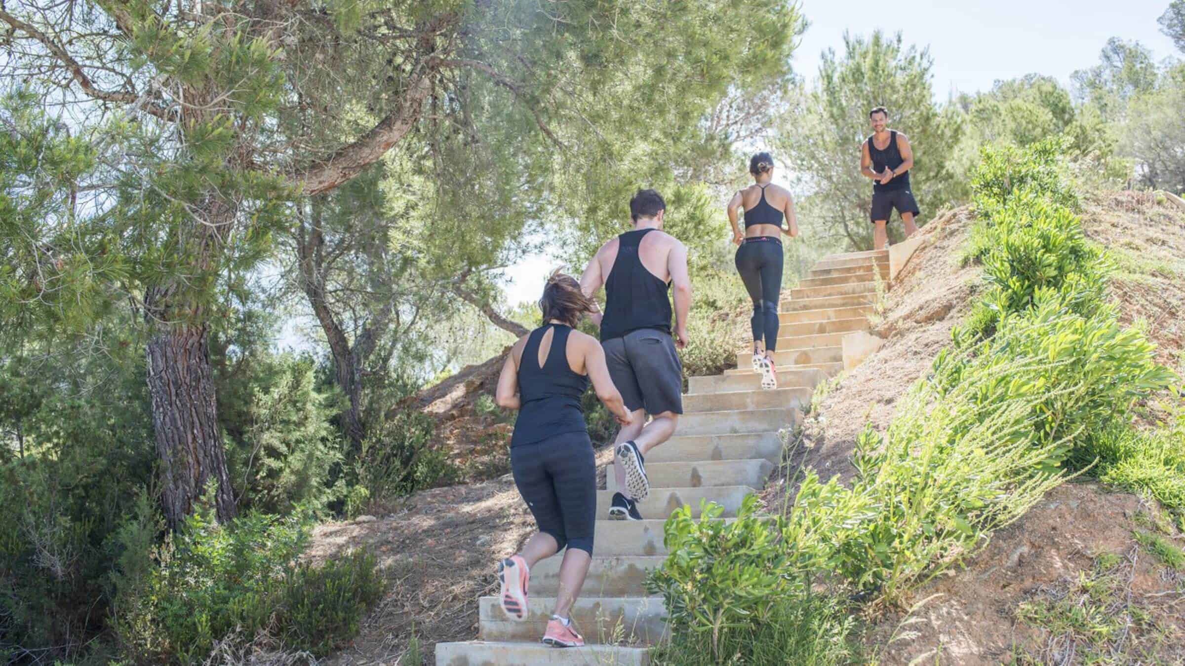 Group Of Men And Women Running Up The Stairs Outdoors (1)